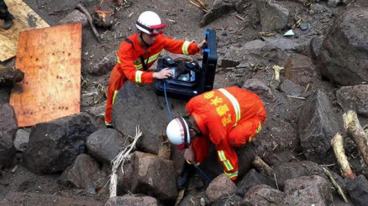 10 bodies found, 31 still buried under rubble in China landslide